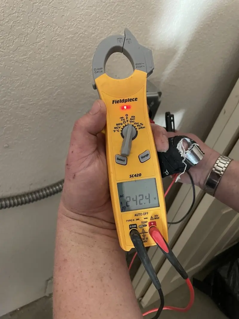 Voltage testing with clamp meter during Hot Tub / Pool Electrical Wiring in Howell